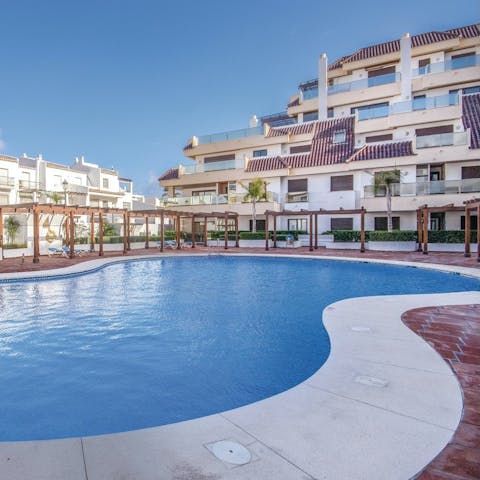 Swim in the communal pool to cool off in the sun
