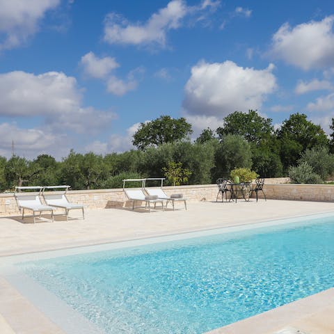 Sunbathe by the sparkling swimming pool