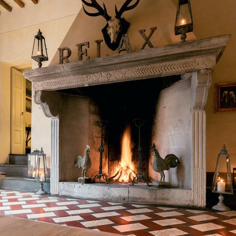 Cosy up around the huge stone hearth