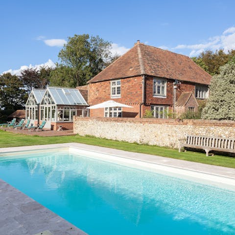 Swim laps of the heated pool while admiring the grounds