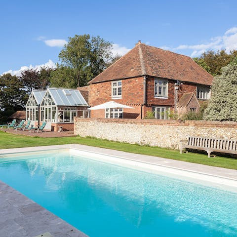 Swim laps of the heated pool while admiring the grounds