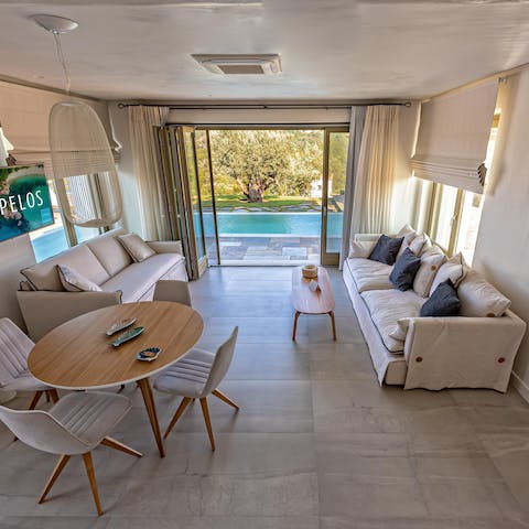 Kick back in the elegant living room before stepping outside to catch some rays