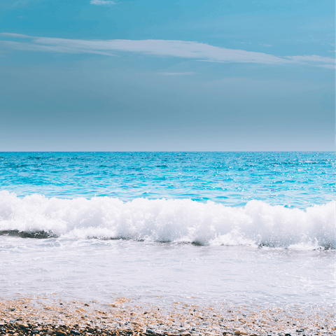 Spend an afternoon at Paralia Glifoneri, also a ten-minute drive from your door