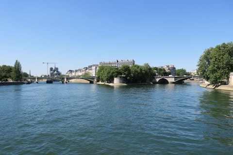 Cross to Île Saint-Louis for gelato and Seine-side charm, just fifteen minutes away