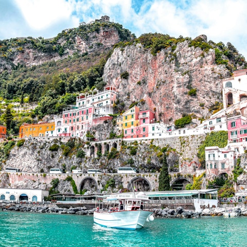 Take a boat tour from the harbour, it's only five minutes away on foot