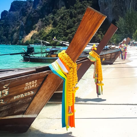 Explore the nearby beach and take a ride in a long-tail boat – one of Thailand's characteristic modes of transport