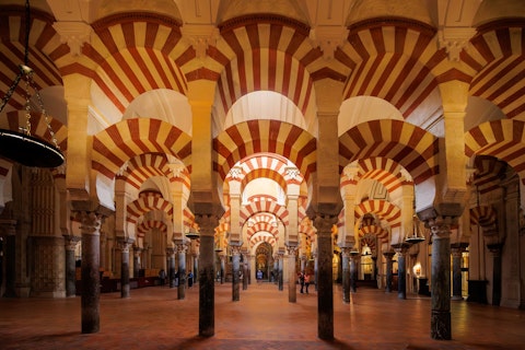Marvel at Córdoba's breathtaking mosque-cathedral, a UNESCO World Heritage masterpiece, a seventeen-minute walk