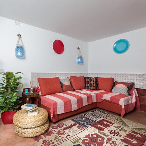 Relax on the sofa with a glass of Italian wine after a day of exploring the city on foot