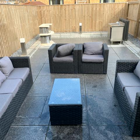 Chill on the comfy outdoor sofas, perfect for summer evenings
