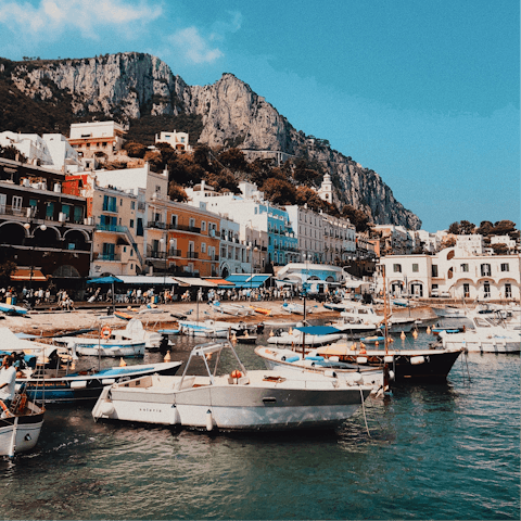 Hop on a boat to tour the Capri coastline – the marina is a short drive away