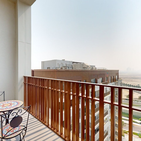 Take in the views over the Dubai Creek neighbourhood on the balcony