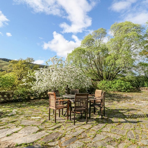 Enjoy five acres of private land, set against a stunning backdrop