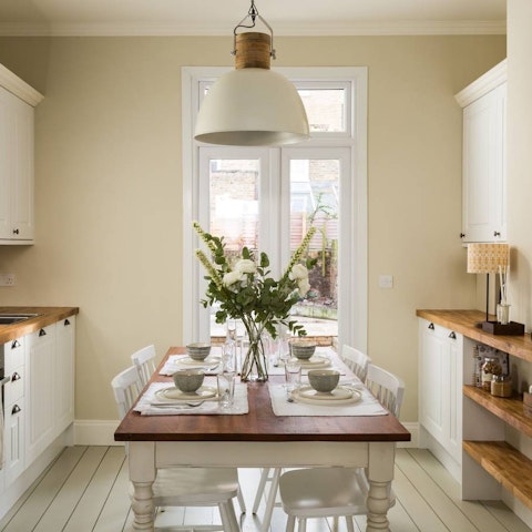 Enjoy a home-cooked meal around the rustic dining table