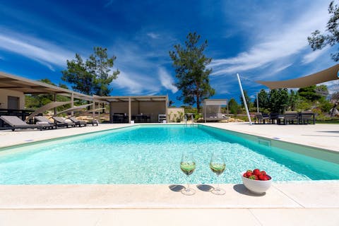 Dip your toes in this refreshing pool, as you sip Greek wine and watch a sunset overhead