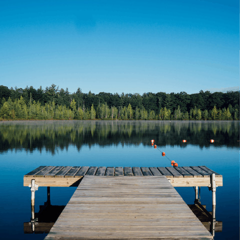 Sip wine on the balcony and admire the views across Howells Mere Lake