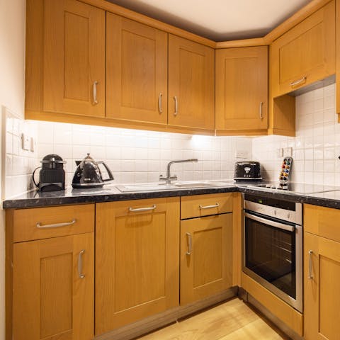 Fire up the coffee pod machine in the well-equipped kitchen