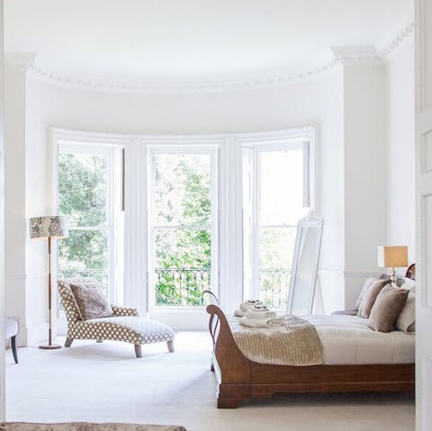 Greet the sunlight through massive bay windows