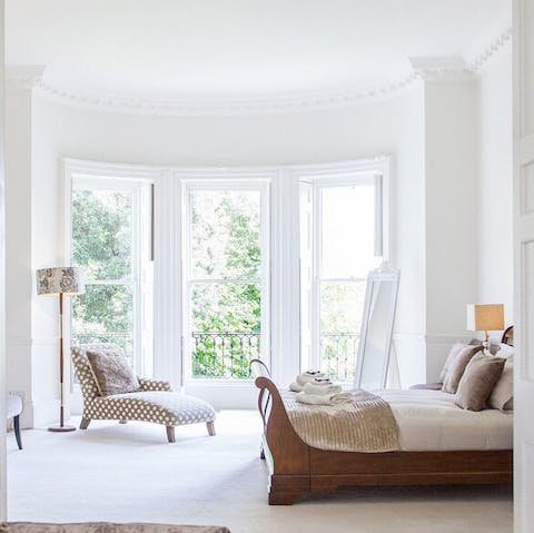 Greet the sunlight through massive bay windows