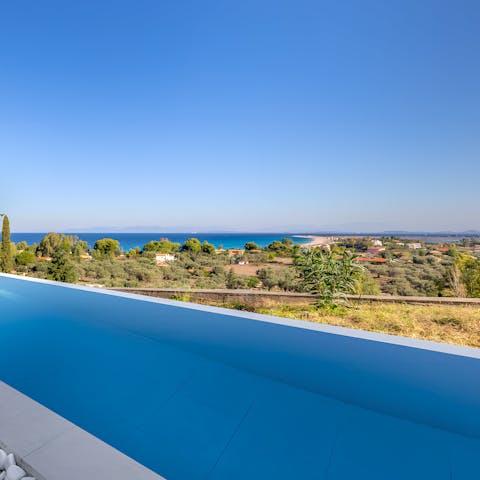 Admire sparkling sea views from the idyllic infinity pool