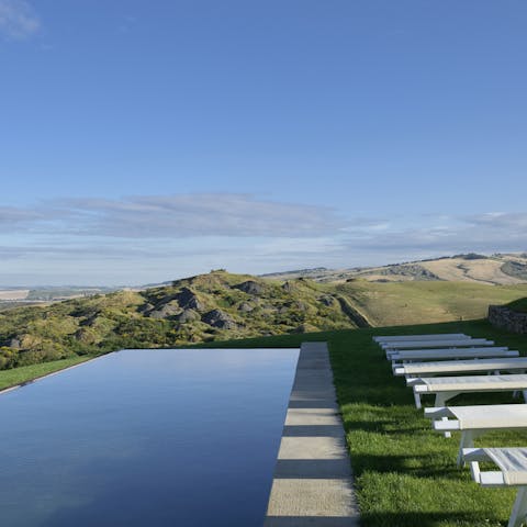 Admire the stunning panoramic views from the infinity pool