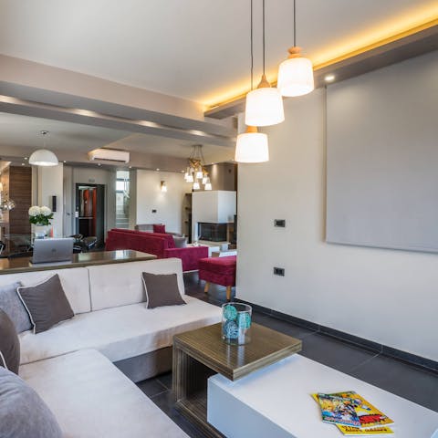 Settle down in the second living area for a movie on the big screen