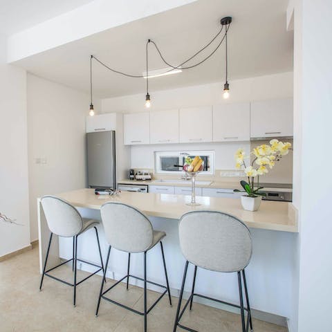 Cook up your favourite meals in the kitchen and tuck in at the breakfast bar
