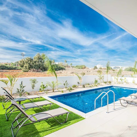 Relax on a poolside lounger while you enjoy the Cyprus sunshine