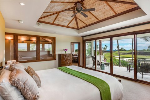 Wake to sweeping fairway views from the bedroom