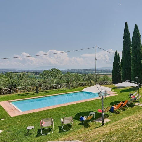 Admire rolling countryside views from the private pool