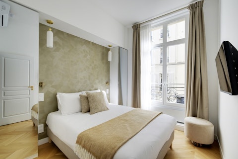 Wake up to Parisian street views from the Haussmann balcony