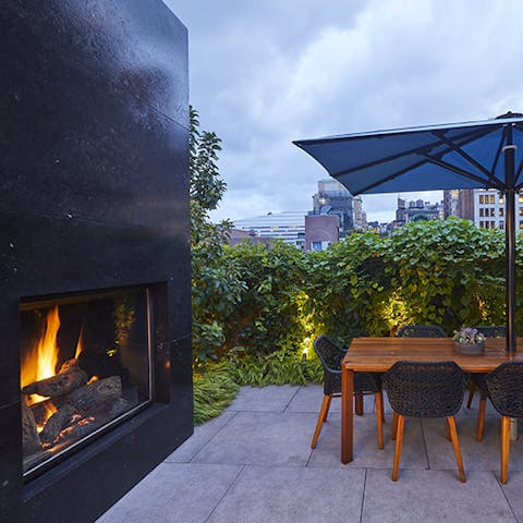 Dine alfresco beside the roaring fire