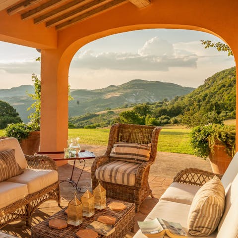 Gather for drinks on the patio as the sun sets