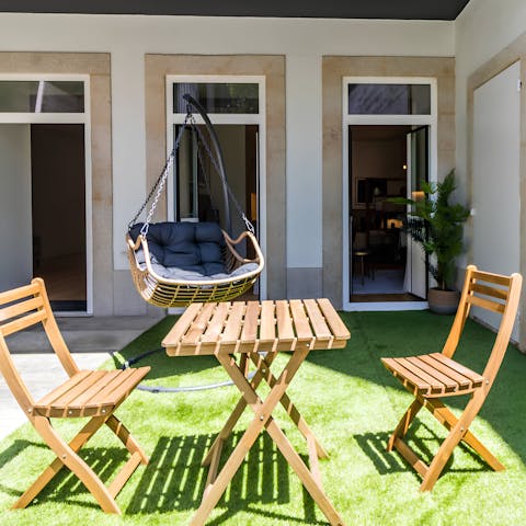 Relax in the private garden under the Porto sun