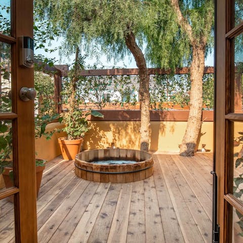 Step out onto the deck and straight into the cedar hot tub