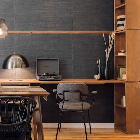 Catch up with your inbox at the workspace while the record player spins