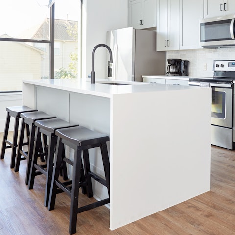 Gather round the kitchen island for an aperitif after a cultural day out in Houston