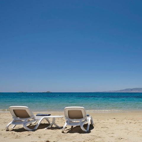 Roll out of bed and be on Plaka Beach in thirty seconds