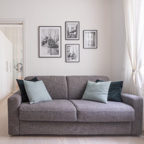 Relax in the pared-back living area with a glass of Italian wine