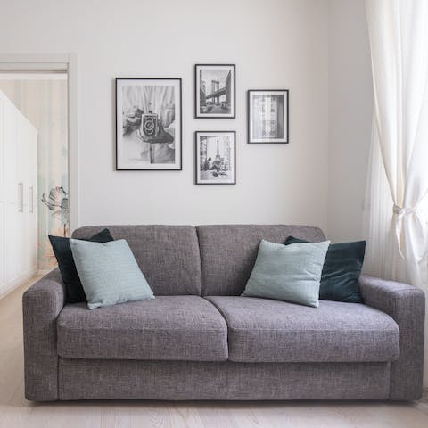 Relax in the pared-back living area with a glass of Italian wine