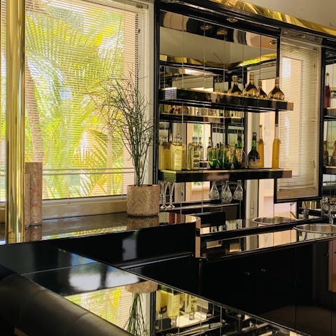 Enjoy a pre-dinner drink at the glamourous retro-style bar