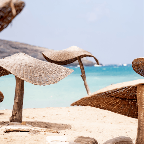 Soak up the sun from Paralia Agios Fokas, a short drive away