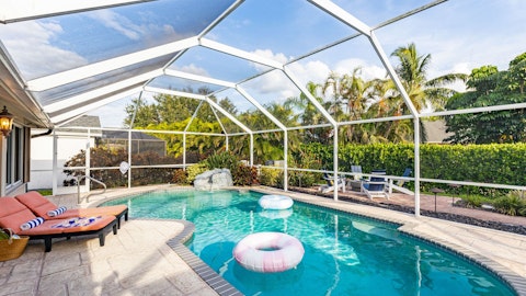 Float in your private screened pool on a lazy afternoon