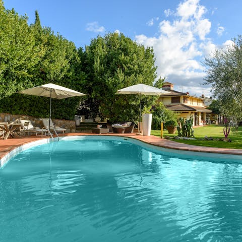 Soak up the Tuscan sun by the private swimming pool