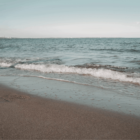 Take a leisurely five-minute stroll and sink your feet into the golden sands at Xyla beach