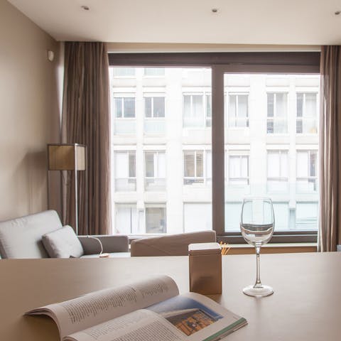 Sip wine in your smart living space, with floor-to-ceiling windows