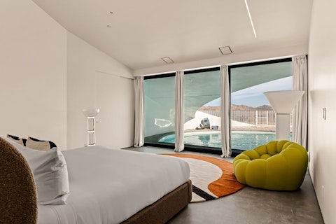 Wake steps from the pool with peaks and open desert sky beyond