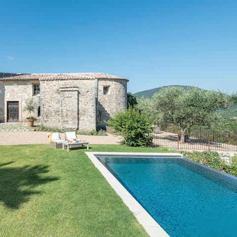 Savour peace and stillness while relaxing by the pool