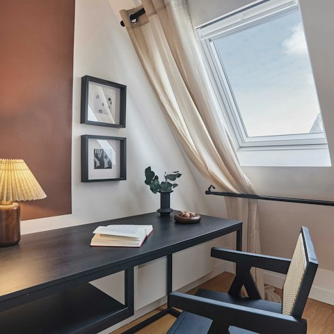 Catch up on emails at the desk in the bedroom