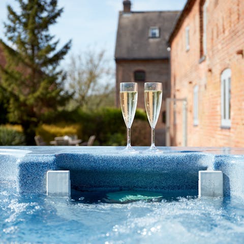Clink glasses in the bubbling hot tub after a day on the walking trails