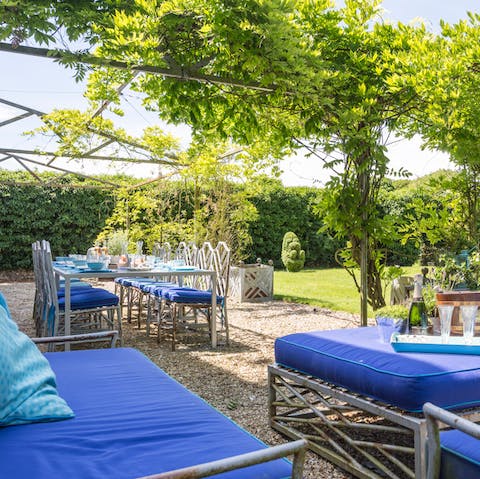 Eat in the open air beneath the vines